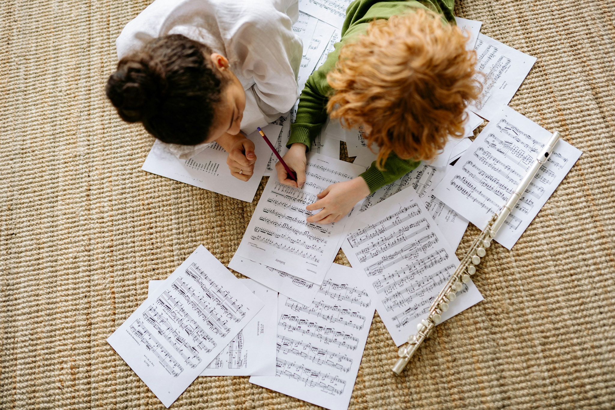 children with sheet music and flute